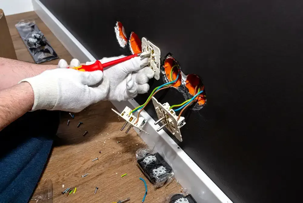Electrical outlet wiring being upgraded during a Deer Park, NY kitchen remodeling project.