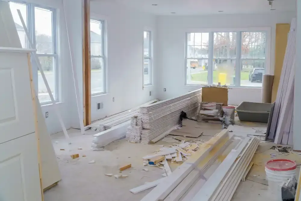 Interior room stripped to the studs during a whole home renovation in Islip, NY.